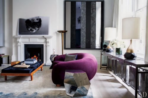by-Francis-Sultana.-Jean-Royère-sofa-is-grouped-with-Bonetti-polished-steel-side-tables-and-a-Charlotte-Perriand-bench